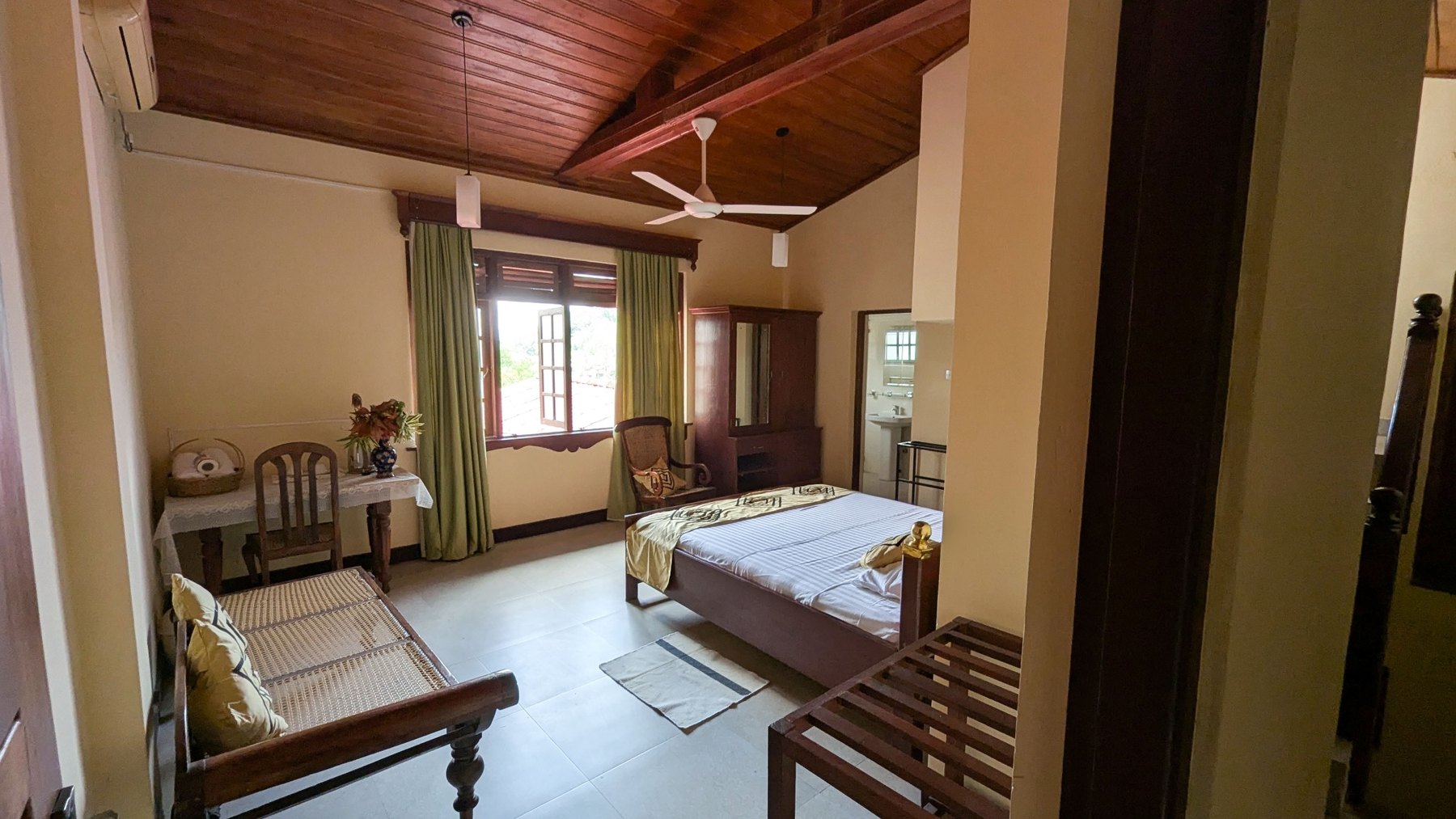 Spacious bedroom with window and seating